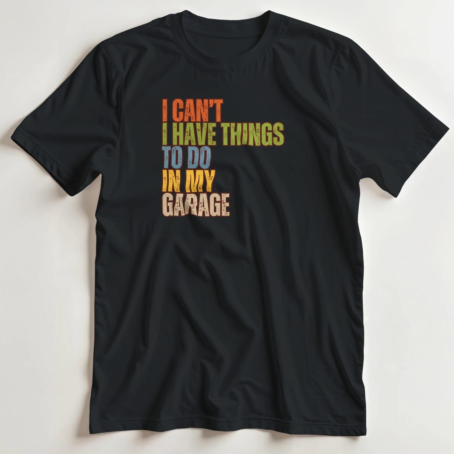 T-shirt en coupe unisexe et 100% coton en Noir M imprimé avec un design I Can't My Garage T-Shirt .