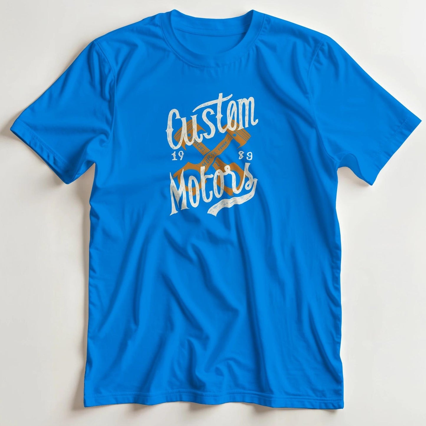 T-shirt en coupe unisexe et 100% coton en Royal imprimé avec un design Custom Motors 1989 T-Shirt .